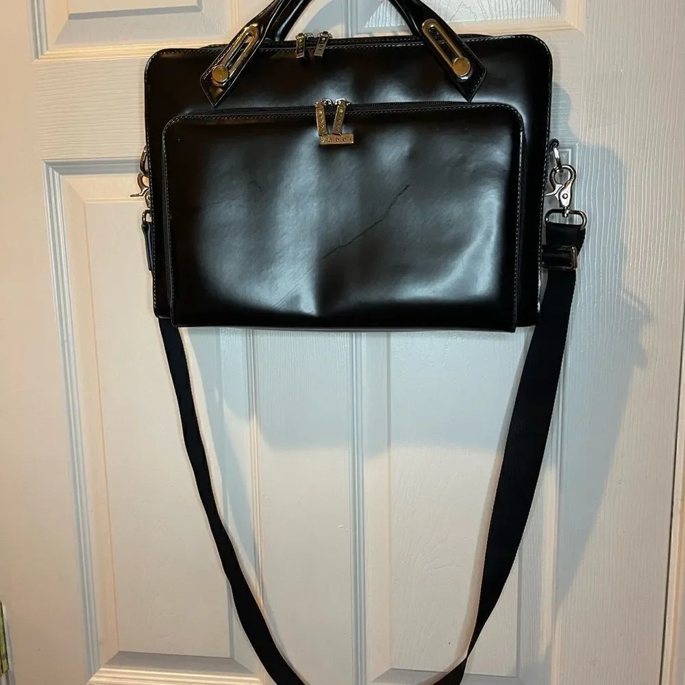 Abbi New York Laptop/Briefcase Carrier Black leather inside padded fabric.